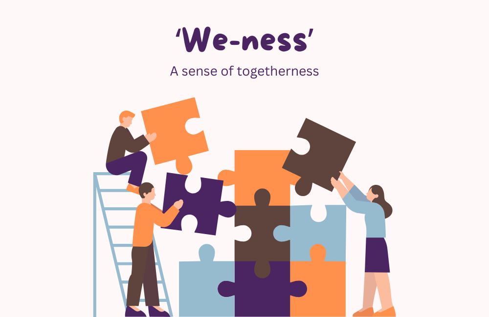 Image of three adults working together to build a large jigsaw puzzle.